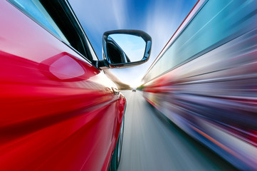 A car driving on a motorway at high speeds