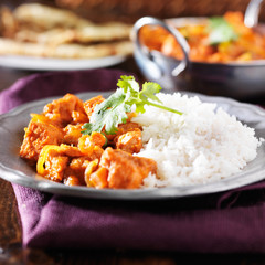 indian chicken vindaloo curry with basmati rice on plate