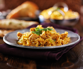 indian food - chicken biryana on metal plate