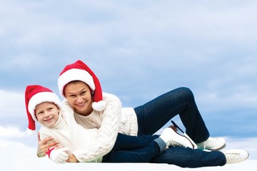 beautiful mother and her daughter hugging at Christmas