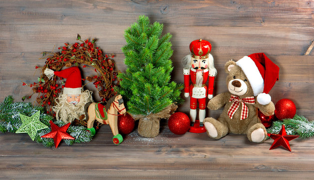 christmas decoration with toys teddy bear and nutcracker