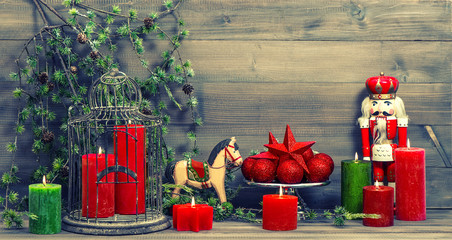 christmas decorations with red candles and vintage toys - Powered by Adobe