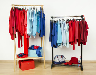 Store wardrobe with red and blue clothes on rack nicely arranged