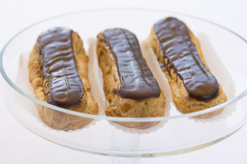 Delicious French Chocolate eclairs on plate