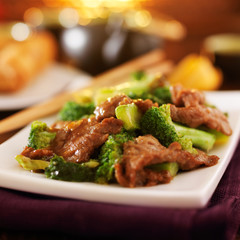 chinese beef and broccoli  stir fry in warm light