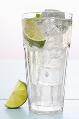 Hugo cocktail with lime, mint and ice cubes