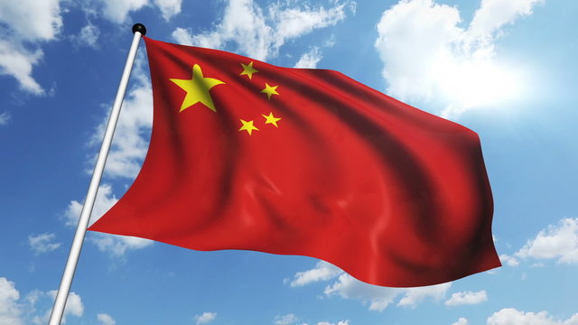 flag of China with fabric structure against a cloudy sky