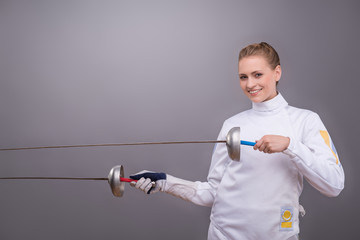 Young woman engaging in fencing