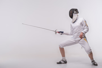 Young woman engaging in fencing