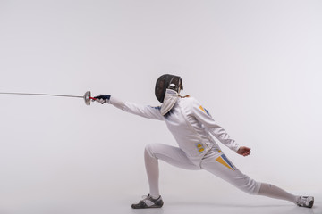 Young woman engaging in fencing