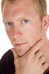 Obraz premium man in purple shirt head close hand chin look