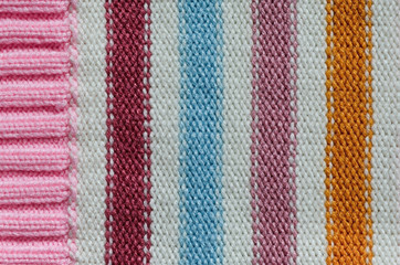 Knit woolen texture. Fabric striped background