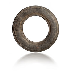 Small old dirty tire isolated