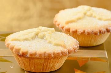 Two golden mince pies, a traditional christmas sweet.