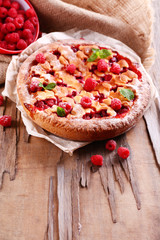 Tasty cake with berries on table close-up