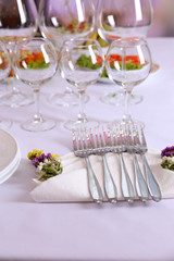 Buffet table with dishware waiting for guests