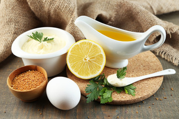 Mayonnaise ingredients on wooden background