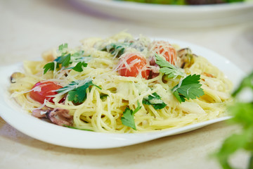 Spaghetti with cherry tomatoes and parsley
