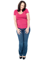 Fototapeta premium Shy middle aged woman isolated on white