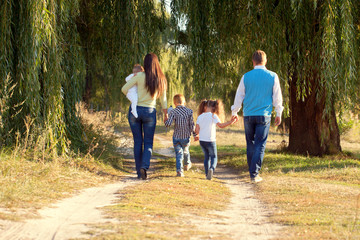 Big family walking in the park.