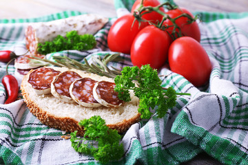 French salami with bread, tomatoes and parsley
