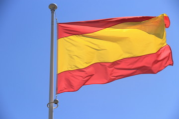 Spain flag without coat of arms to blue sky