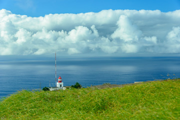Lighthouse above the clouds