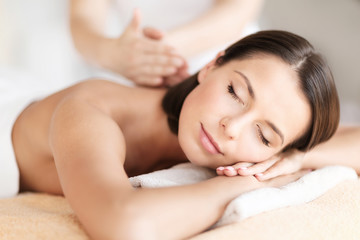 Fototapeta na wymiar beautiful woman in spa salon getting massage