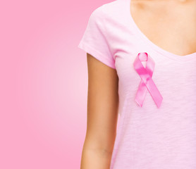 close up of woman with cancer awareness ribbon
