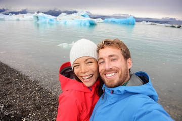 Couple taking selfie by Jokulsarlon on Iceland