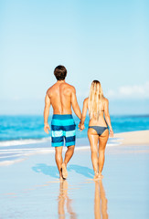 Attractive Couple Walking on Tropical Beach