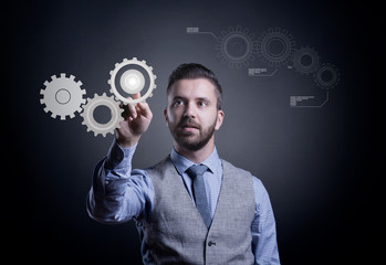 Hipster businessman working on virtual interface