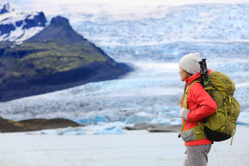 Fototapeta na wymiar Adventure hiking woman by glacier on Iceland