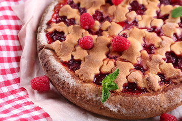 Tasty cake with berries on table close-up