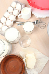 Baking tasty pie and ingredients for it on table in kitchen