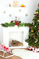 Fototapeta na wymiar Christmas tree near fireplace in room
