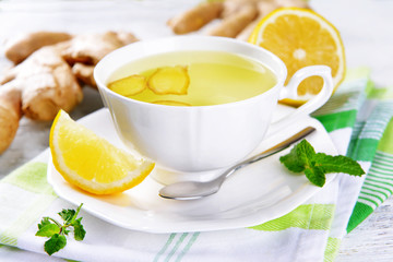 Ginger tea with lemon on table close-up