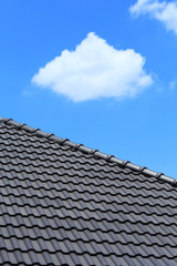tile roof on a new house with blue sky