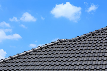 tile roof on a new house with blue sky