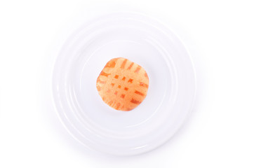 Honey cakes on plate isolated on white background