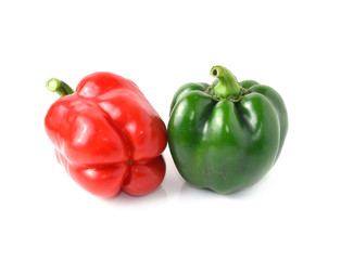 Green, red bell peppers on a white background