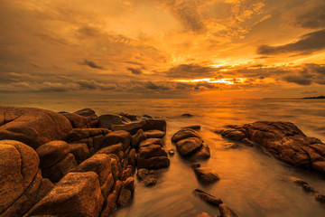 Rocks and wave at the sea in the sunset, Thailand