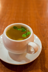 glass cup with green tea and mint