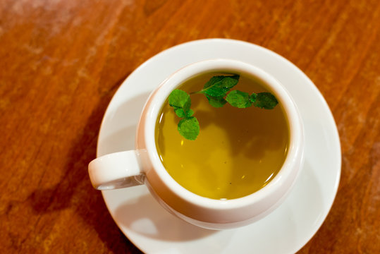 glass cup with green tea and mint