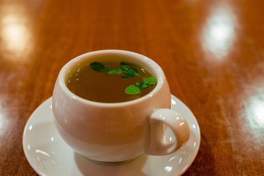 glass cup with green tea and mint