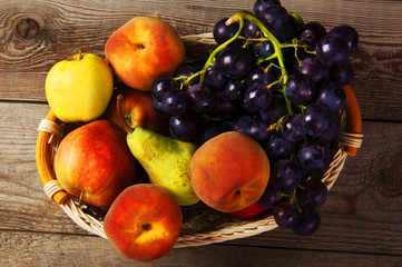 Naklejka na ściany i meble Fresh harvest of apples, peach, grapes and pears.