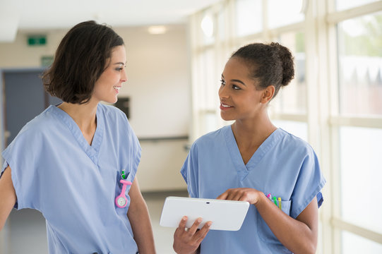 Female nurses watching a clip on a digital tablet