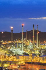 Oil refinery with sunset sky