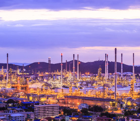 Oil refinery with sunset sky