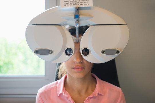Woman undergoing eye exam